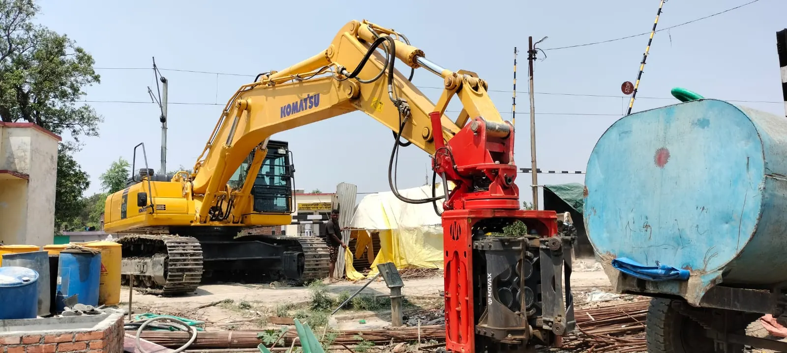 Sheet piling beside a water tank, Uttar Pradesh, 2026, infrastructure work by M/S VKJJVBBNINFRA