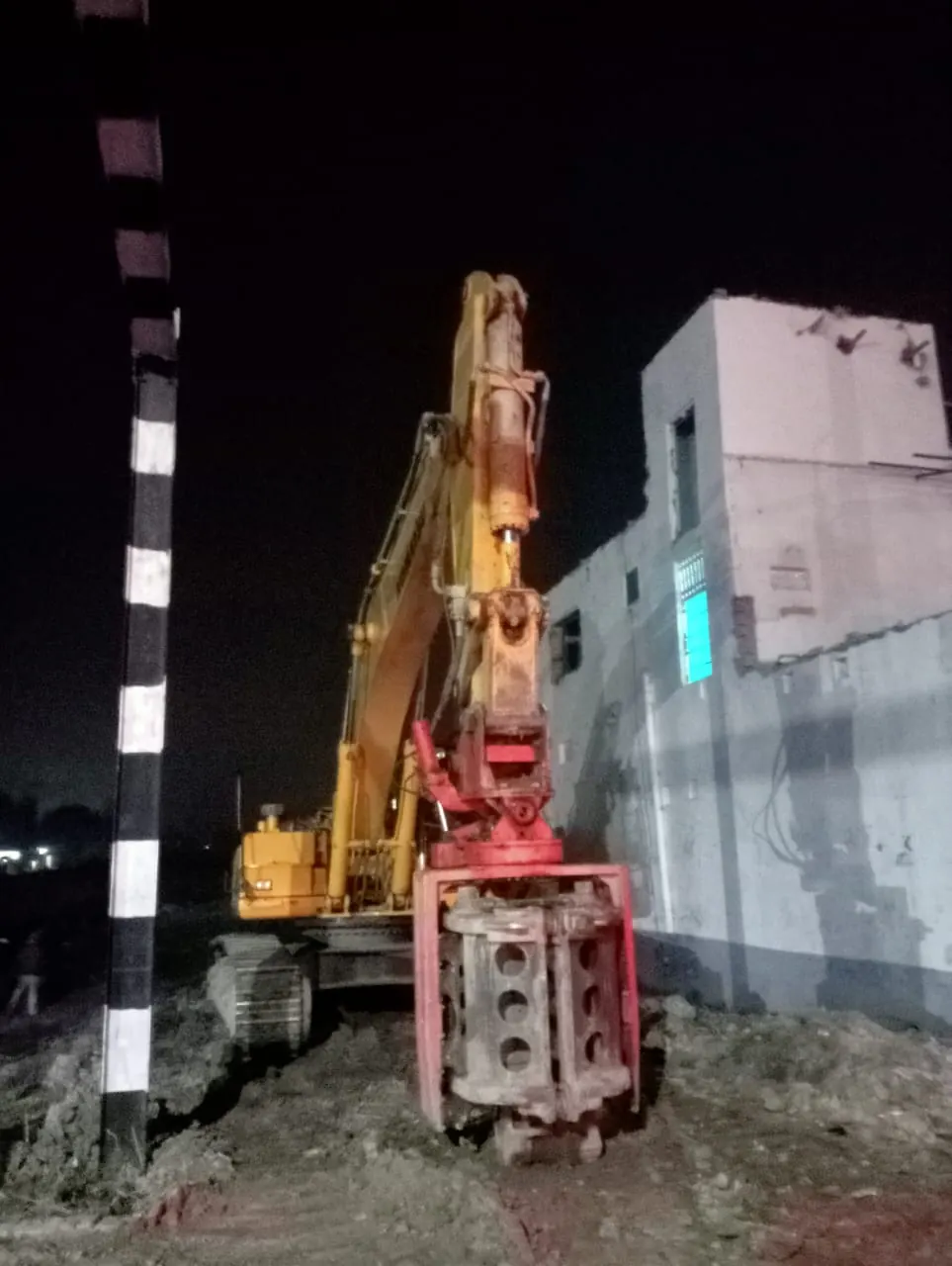Night piling beside a building, Uttar Pradesh, 2026, infrastructure work by M/S VKJJVBBNINFRA