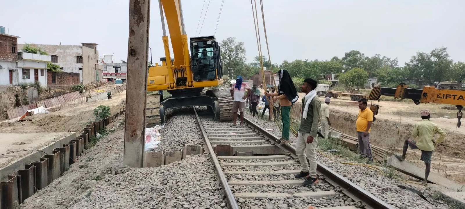 Pile line beside the railway, Uttar Pradesh, 2026, infrastructure work by M/S VKJJVBBNINFRA